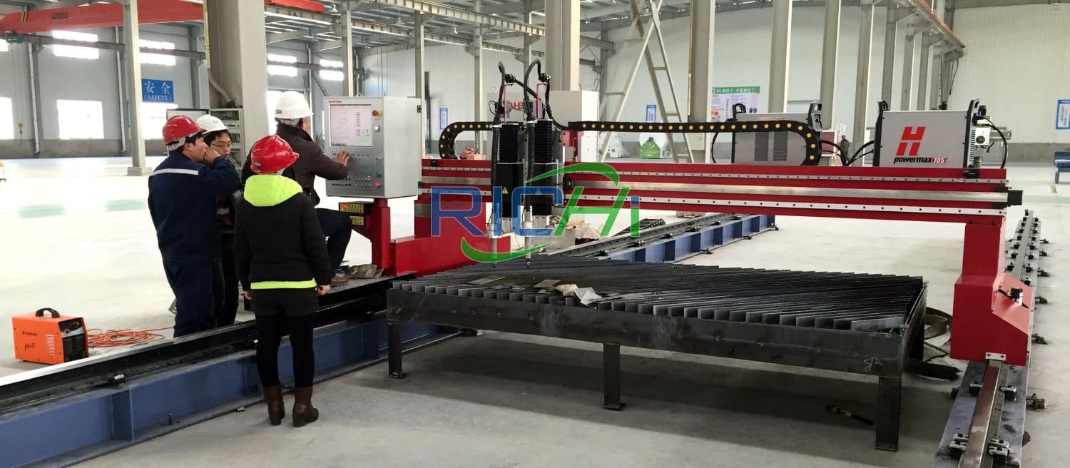 Workers are manufacturing equipment.