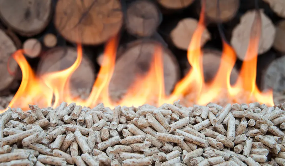 The presence of longer wood chip particles behind the flames and wood has been noted.